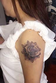 white women's arm black and white rose tattoo tattoo