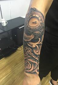clock and feather combined arm tattoo Picture