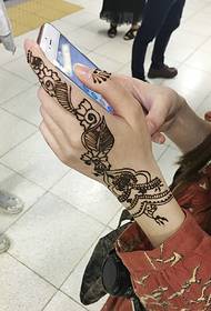a group of girls especially like the arm Henna tattoo tattoo