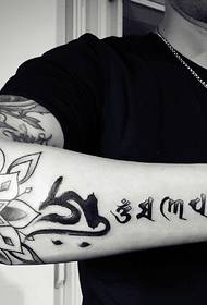 lotus and Sanskrit combined arm tattoo pictures