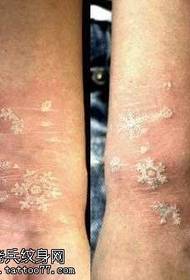 arm trend white snowflake tattoo pattern
