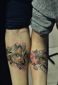 un par de brillantes ollos de Deus brazo parella tatuaxe