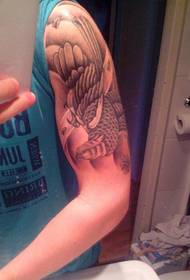 cool skull tattoo on the big arm