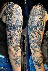 arm black flower vine tattoo pattern