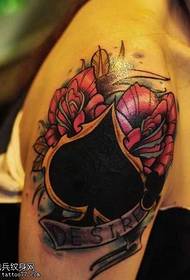 arm spades heart rose tattoo pattern