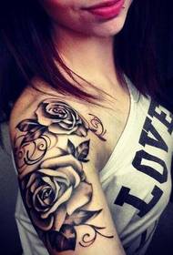 arm personality black and white rose tattoo