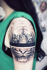 lady's arm fierce tiger head tattoo pattern