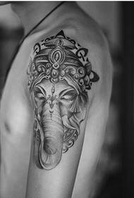 beautiful black-gloss elephant tattoo on the arm